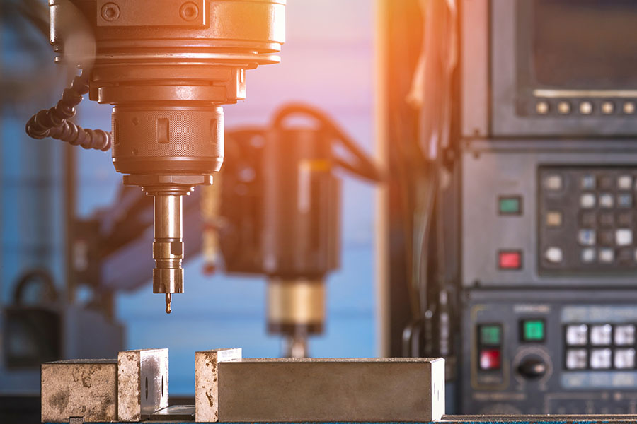 close up of cnc milling machine manufacturing aluminium machined components and parts